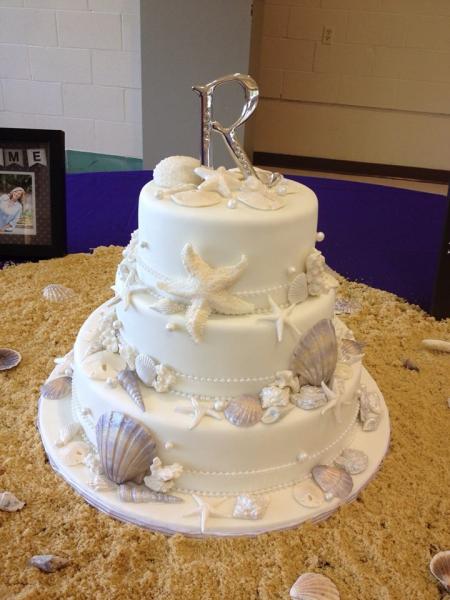 A seashell themed wedding cake.