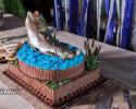 This realistic display of a fish leaping from blue water frosting is perfect for anyone who loved the outdoors!