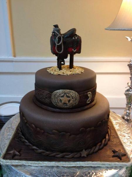 For the cowboys and lovers of rustic decor, this fabulous brown cake layered with rope and topped with a saddle would  be perfect for you!
