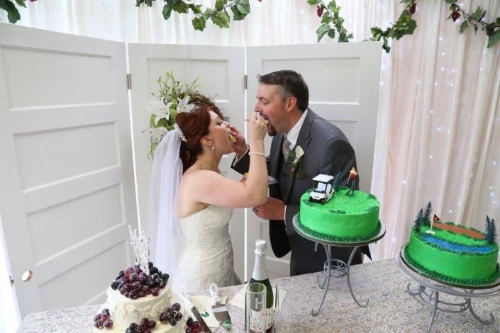 Bride & Groom with their Cakes