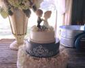 An adorable wedding cake with a Precious Moments topper.