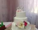 A beautiful 3 tier wedding cake with gorgeous flowers.