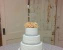 A beautiful wedding cake with crystal embellishments.