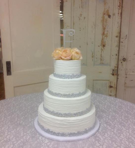 A beautiful wedding cake with crystal embellishments.