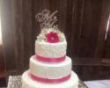 A beautiful pink & white wedding cake.