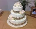 A beautiful wedding cake with burlap.